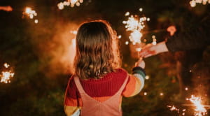 Young girl at fireworks display